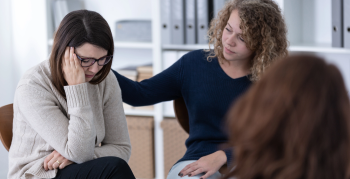 adults sitting together in support group