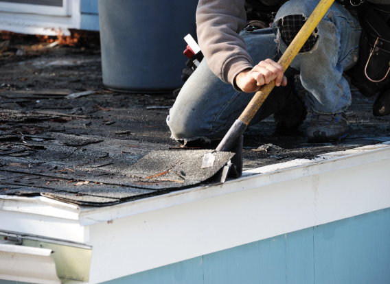 roofer repairing roof